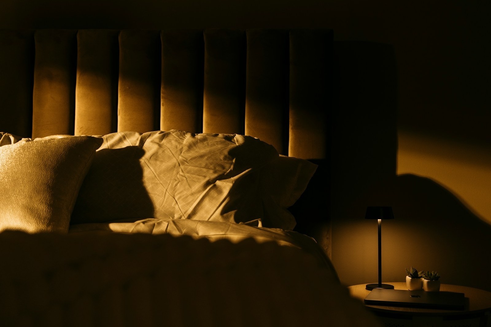 Soft morning light through bedroom curtains representing hope and recovery from PTSD nightmares